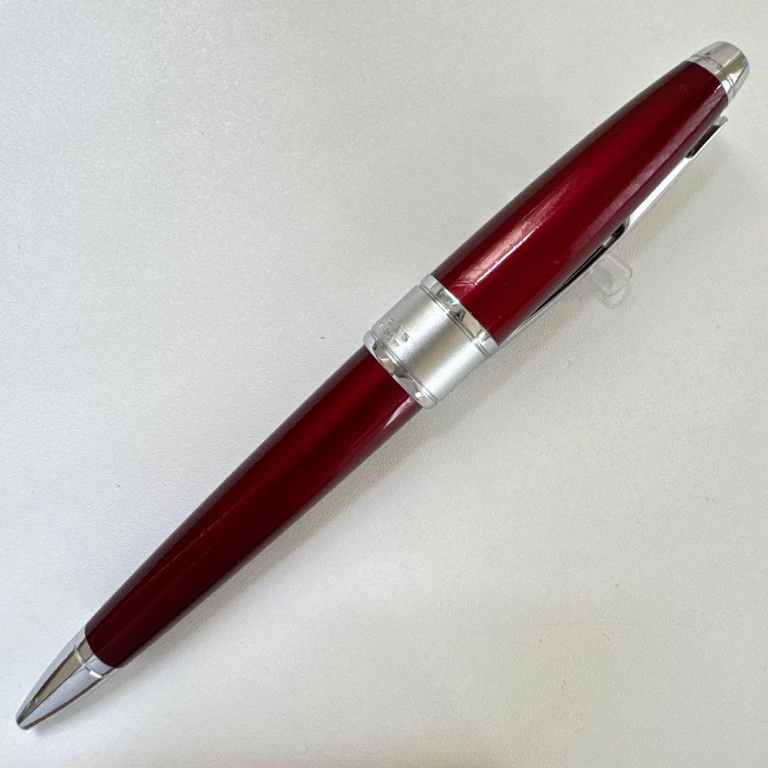 Cross Apogee red ballpoint pen with twist mechanism, Japan import, showing minor signs of use