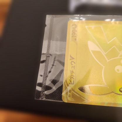 Unopened Pokémon 25th Anniversary Golden Box Pikachu V promo card from Japan import with no visible damage