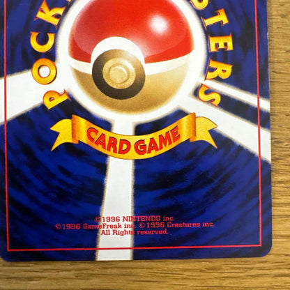 Old back Thunder Pikachu Pokemon card with spiral holo effect in protective sleeve showing slight wear