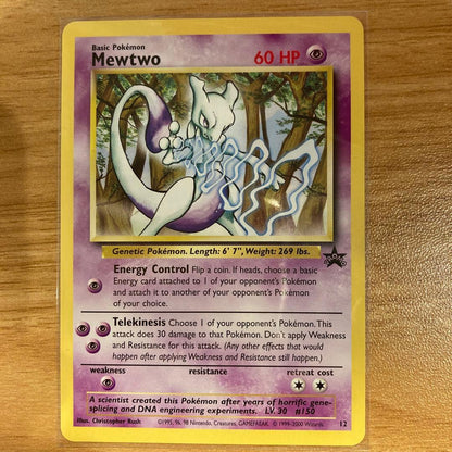Japanese Mewtwo Stamp Rally 2000 promo card from Pokemon TCG with backing sheet showing minor wear