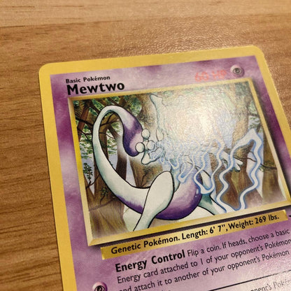 Japanese Mewtwo Stamp Rally 2000 promo card from Pokemon TCG with backing sheet showing minor wear