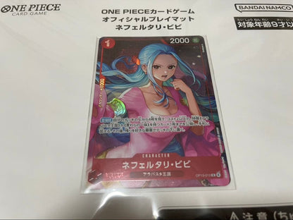 One Piece Badge Neferutari Vivi character playmat with promo card made of polyester and rubber folded in packaging