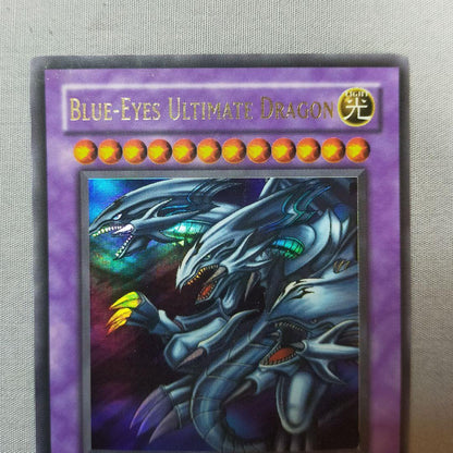 2006 Blue-Eyes Ultimate Dragon Ultrare Card with minor damage from North America Jump Edition