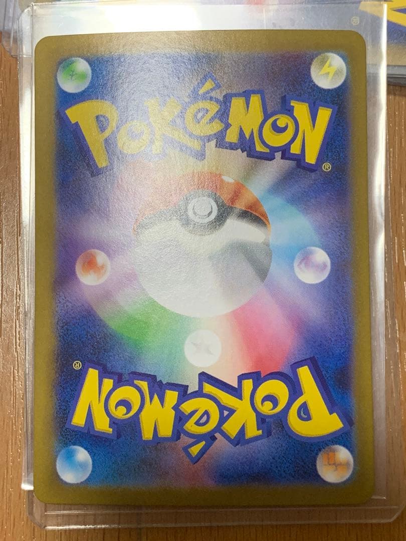 Pokemon Card Zekrom EX 174/086 BWR shown in protective packaging against damage and water
