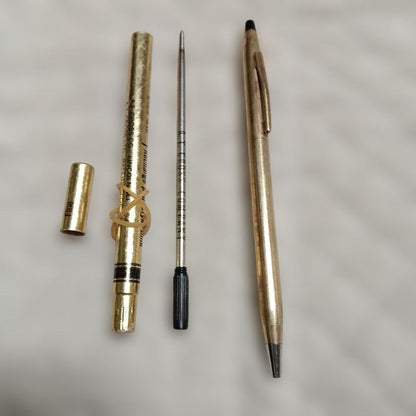 Gold-colored ballpoint pen with replacement ink cartridge, Japanese import, brand unknown