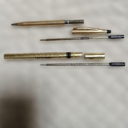 Gold-colored ballpoint pen with replacement ink cartridge, Japanese import, brand unknown