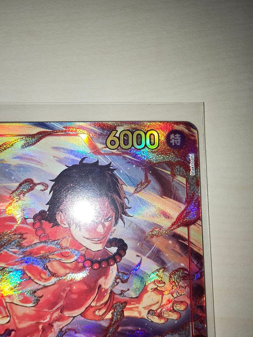 One Piece Card Battle of Wills featuring Ace Secret Parallel card in used condition stored in hard sleeve