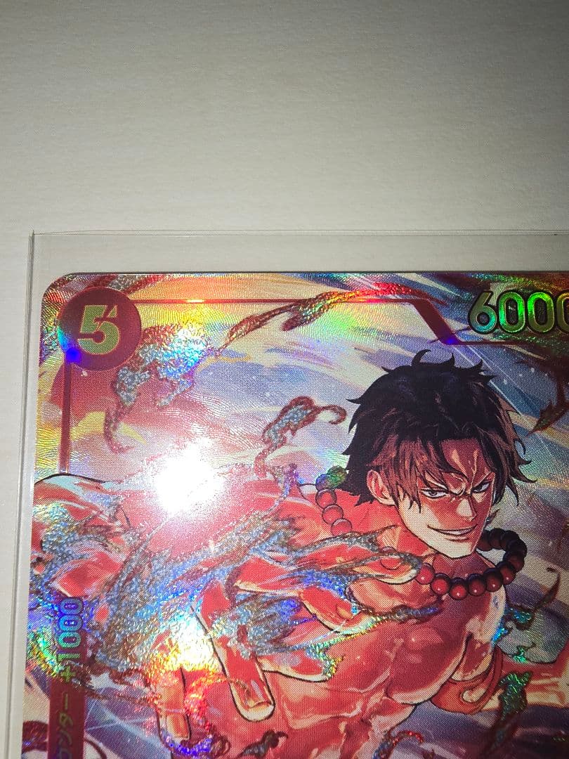 One Piece Card Battle of Wills featuring Ace Secret Parallel card in used condition stored in hard sleeve