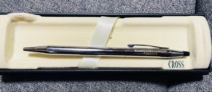 Cross silver ballpoint pen displayed with its dedicated case on a white background