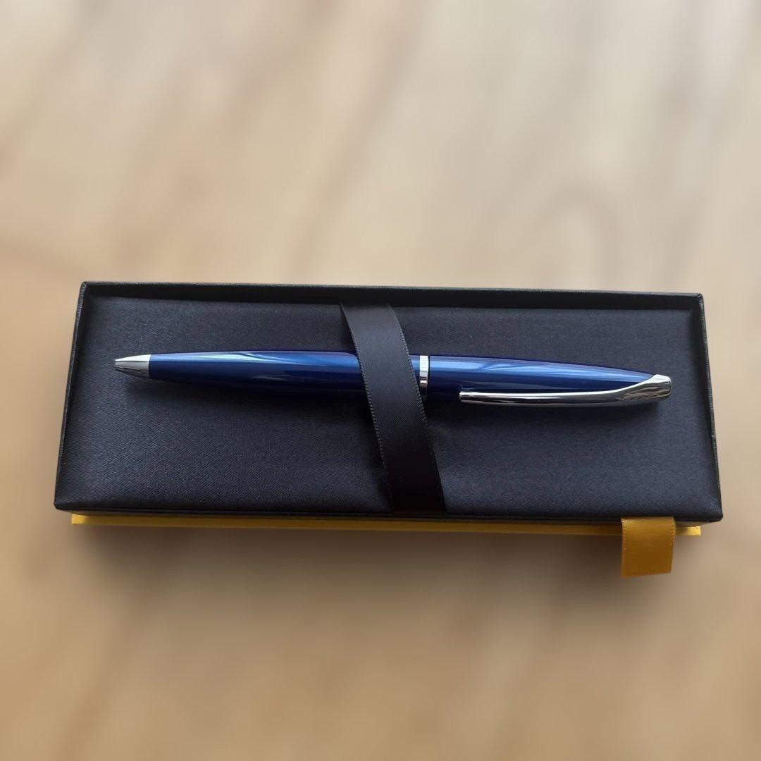 Cross ballpoint pen with blue body, silver accents, and included gift case