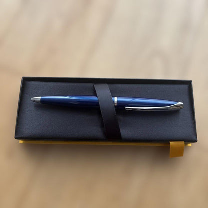 Cross ballpoint pen with blue body, silver accents, and included gift case