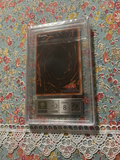 ARS Blue-Eyes White Dragon Initial Model card graded 8 in protective ARS case with slight sleeve damage