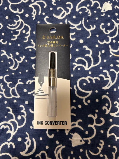 Sailor NMF fountain pen with medium fine 21K gold nib and black trim, shown with cap on
