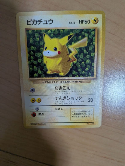 Used Pikachu Pokemon trading card level 16 with 60 HP and Electric Shock attack from Pocket Monster series