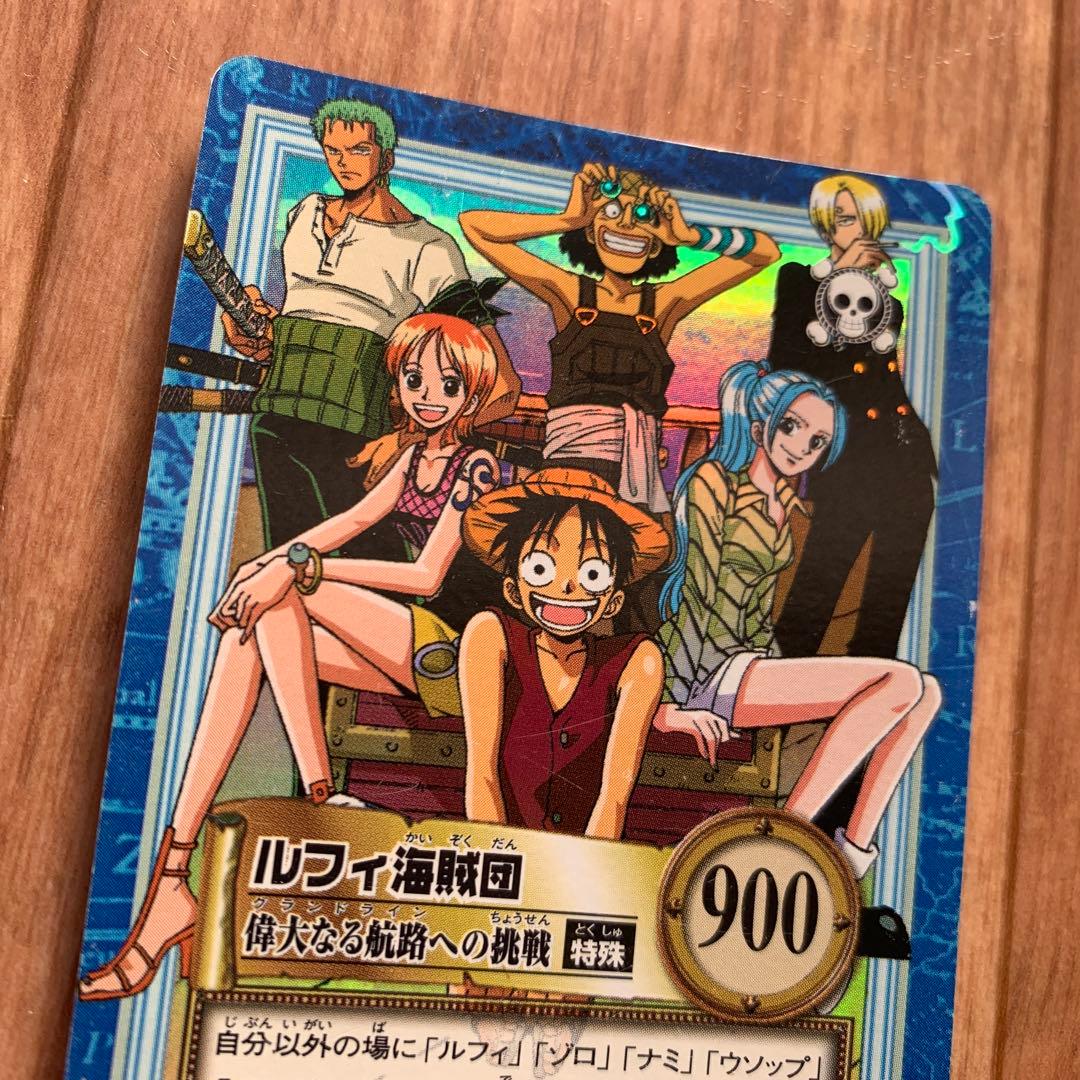 One Piece Prism collectible card pack featuring Luffy, Nami, Zoro, Usopp, Sanji, and Vivi characters