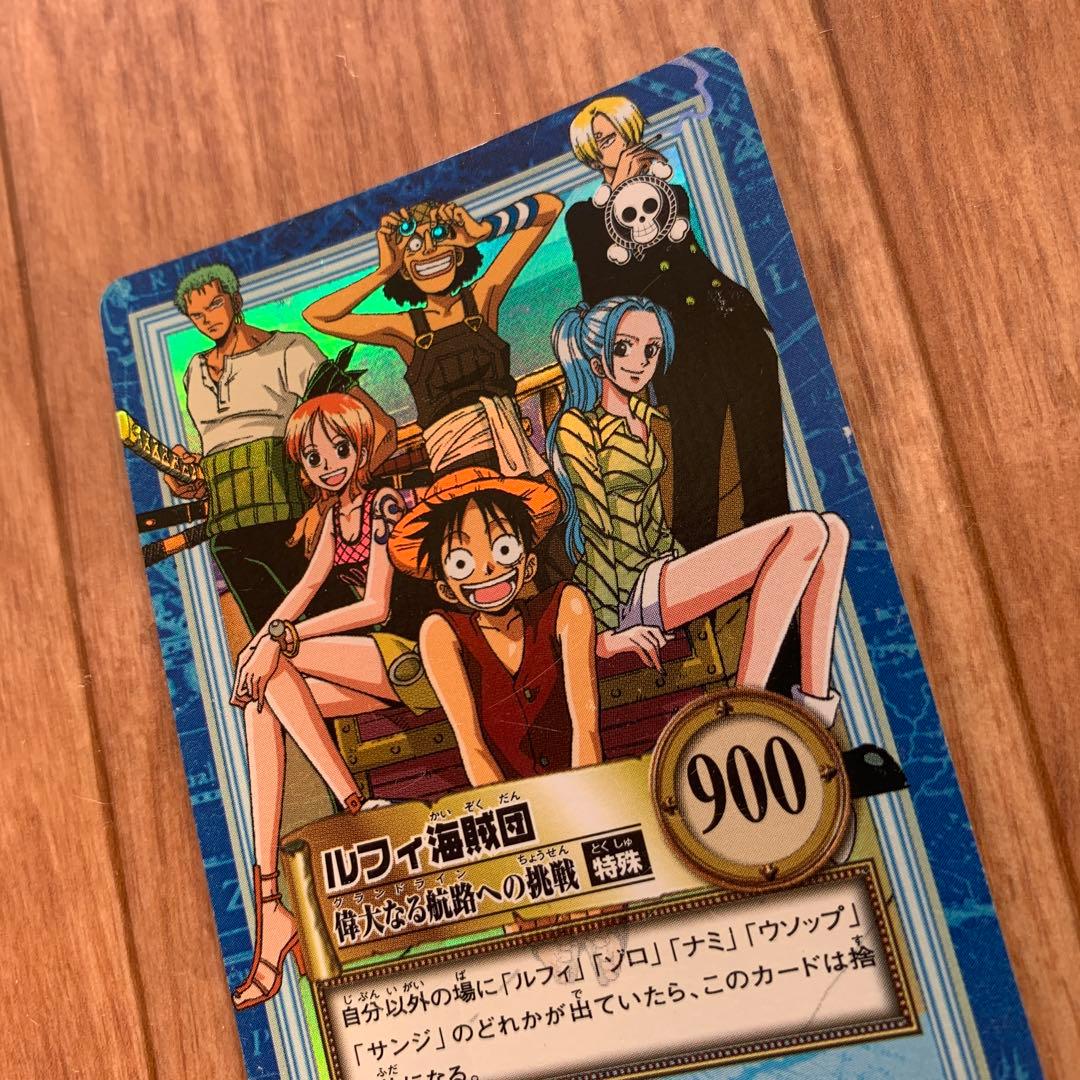 One Piece Prism collectible card pack featuring Luffy, Nami, Zoro, Usopp, Sanji, and Vivi characters