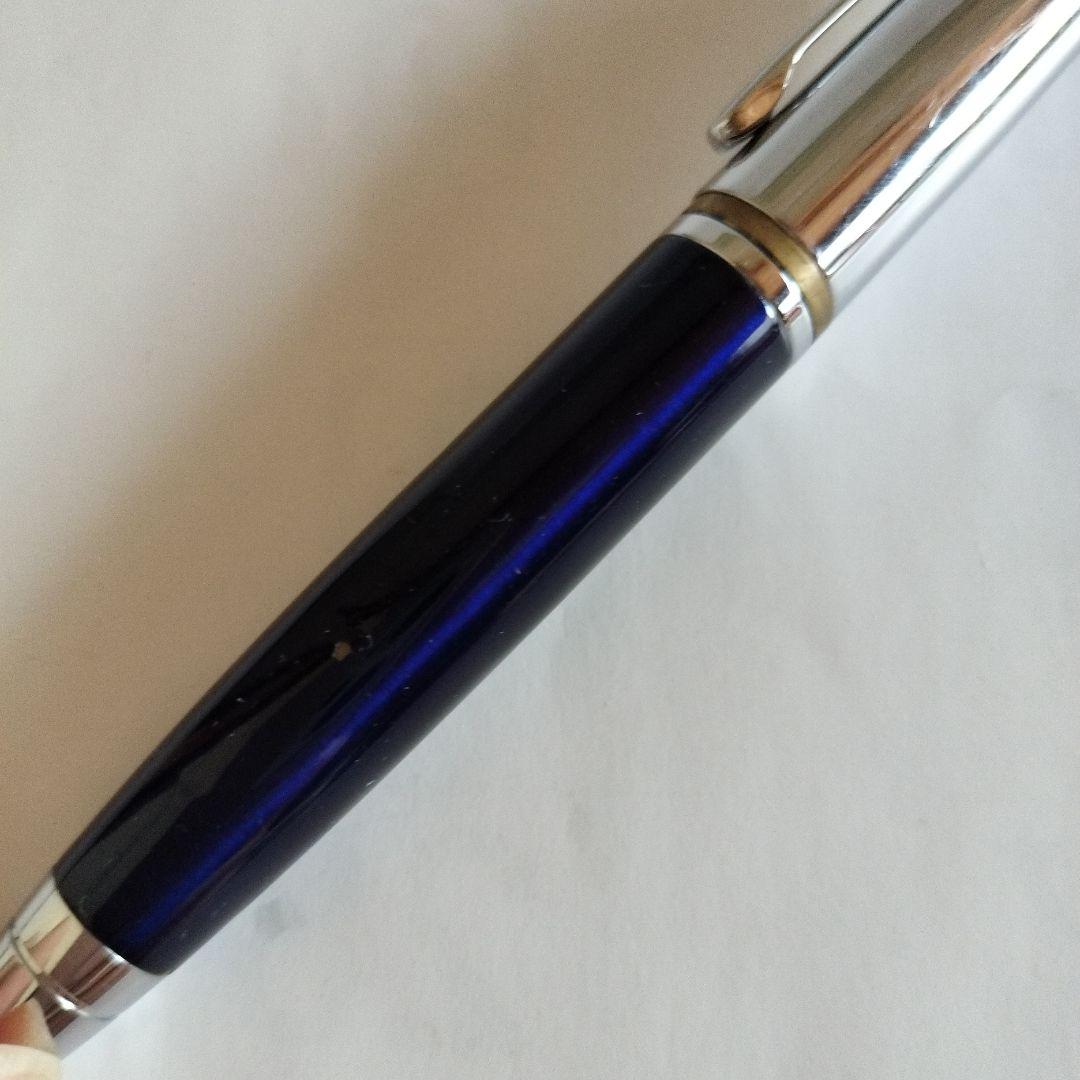Sigma Cross ballpoint pen Japan import showing black ink with signs of use including small scratches and paint peeling