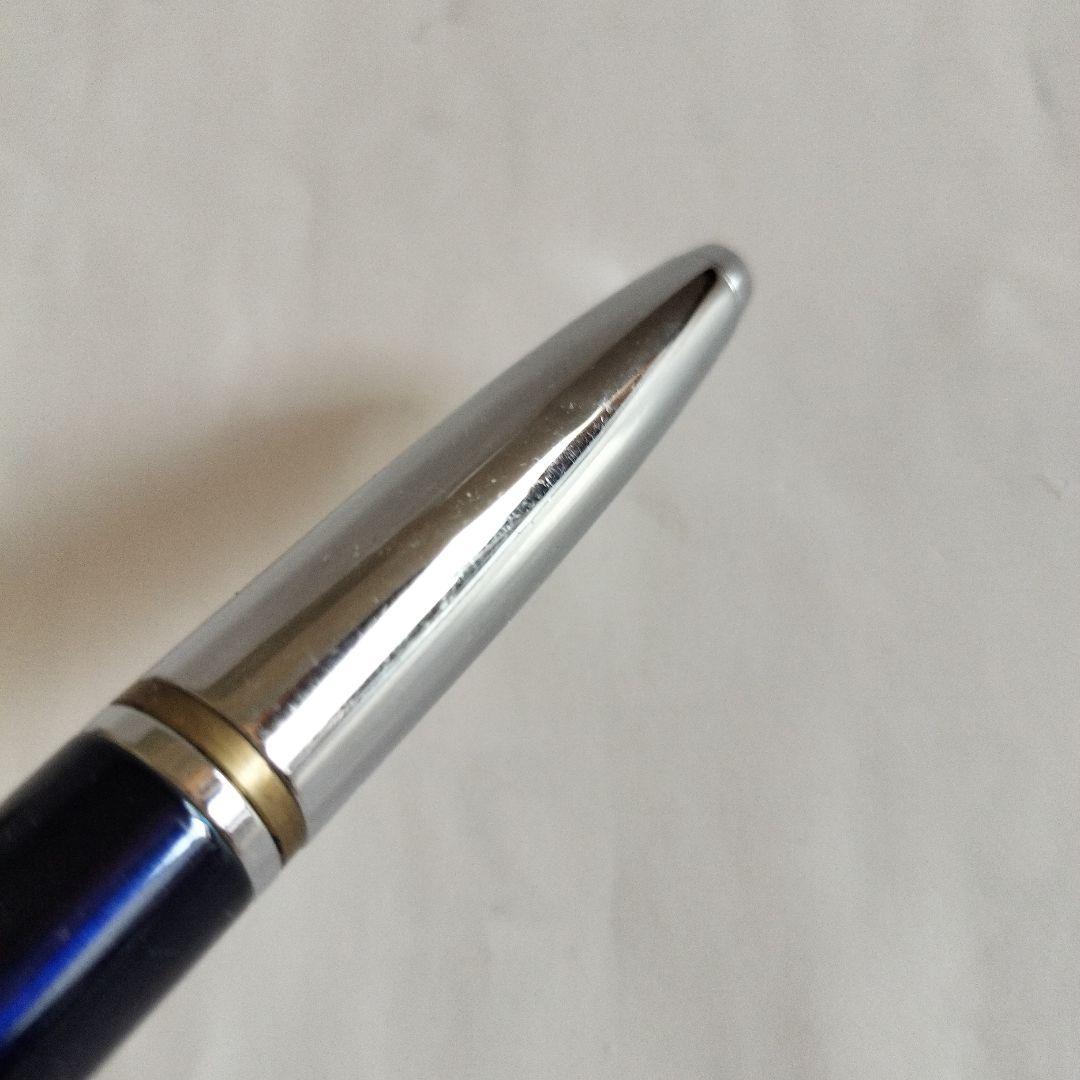 Sigma Cross ballpoint pen Japan import showing black ink with signs of use including small scratches and paint peeling