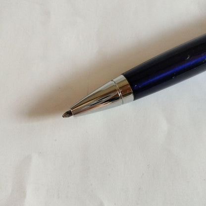 Sigma Cross ballpoint pen Japan import showing black ink with signs of use including small scratches and paint peeling