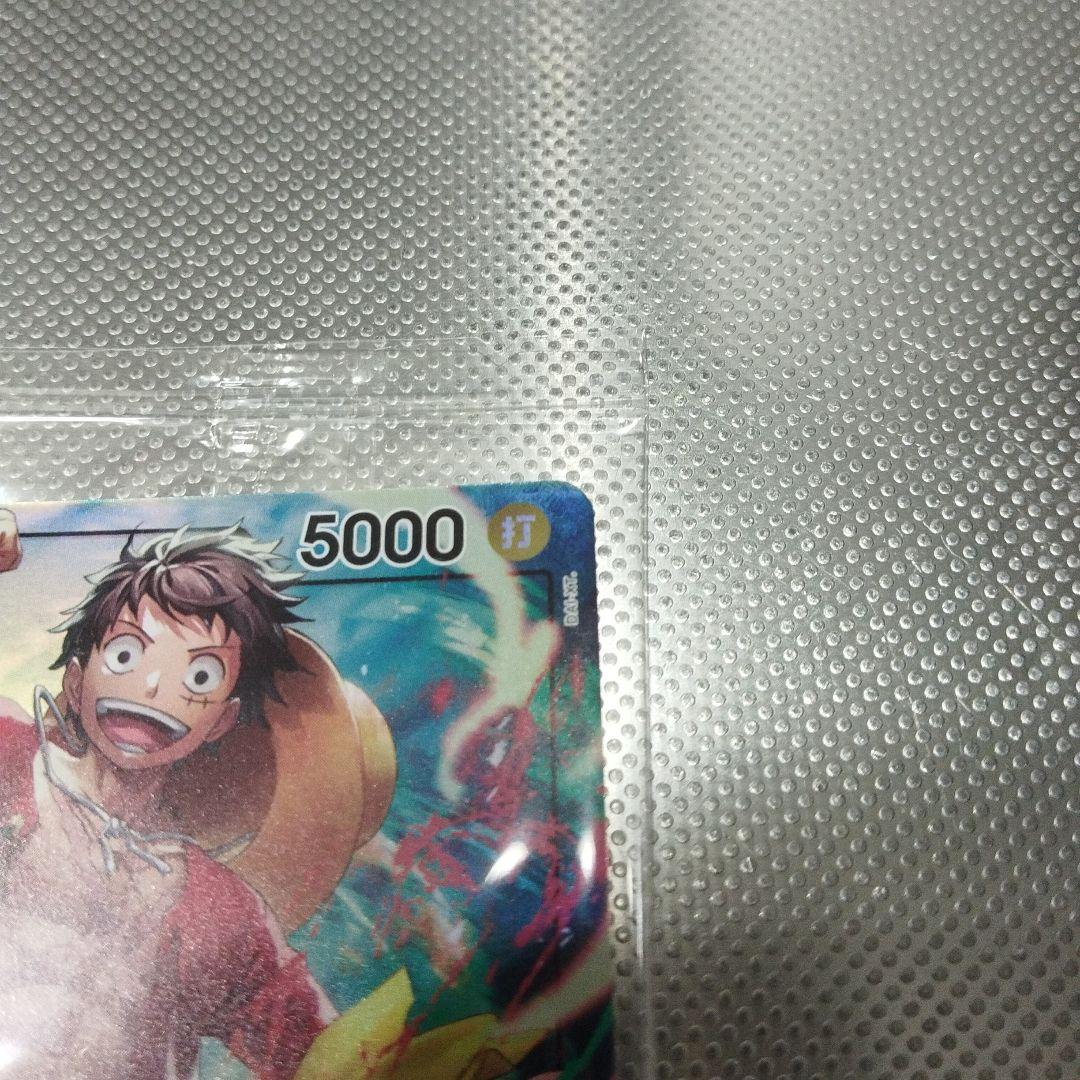 Unopened One Piece Monkey D. Luffy card with 5000 attack power and black yellow leader color from Seven Eleven promo