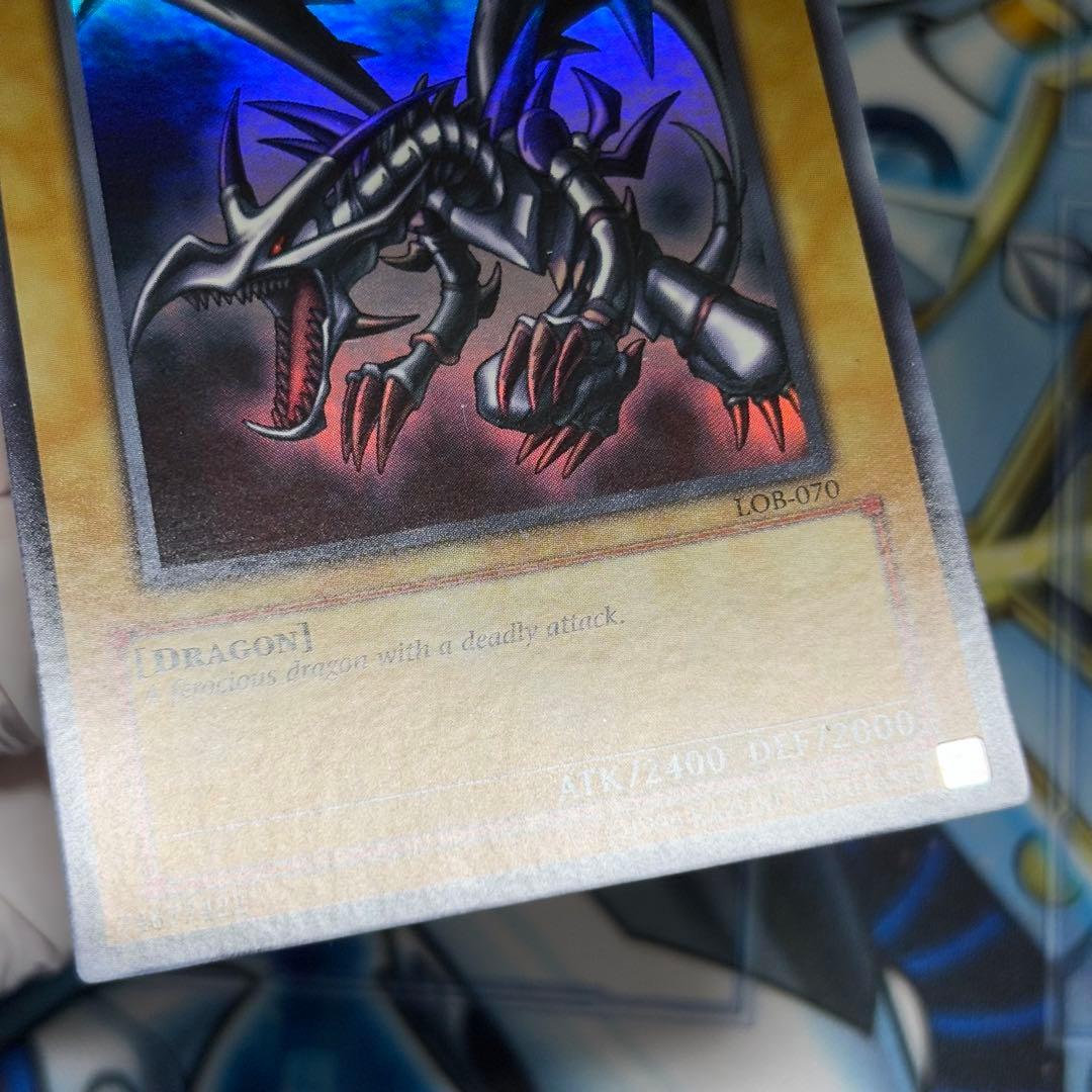 Yu-Gi-Oh Red-Eyes Black Dragon Legend of Blue Eyes White Dragon Ultra Rare card in double sleeve loader