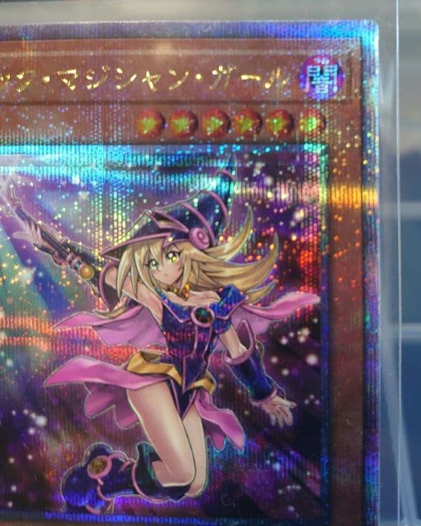 Yu-Gi-Oh Black Magician Girl 25th Edition trading card in protective sleeve