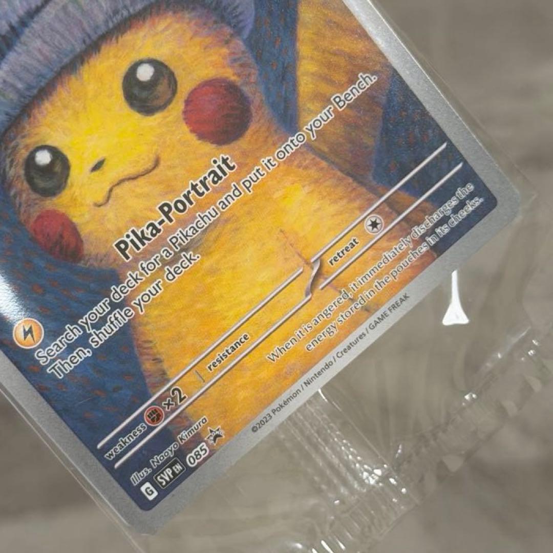 Unopened Gogh Pikachu figure wearing grey felt hat with minor white scratch on lower left side