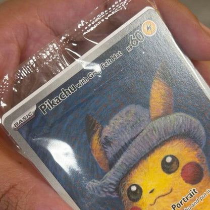 Unopened Gogh Pikachu figure wearing grey felt hat with minor white scratch on lower left side