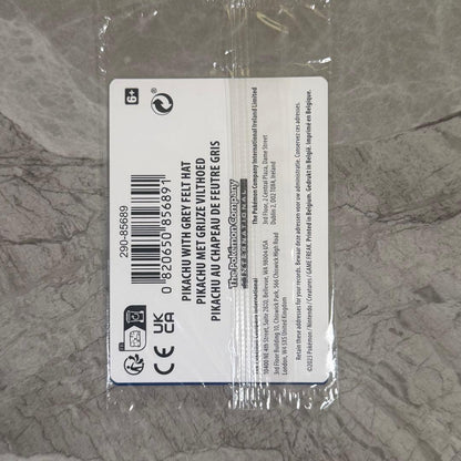 Unopened Gogh Pikachu figure wearing grey felt hat with minor white scratch on lower left side