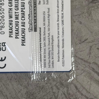 Unopened Gogh Pikachu figure wearing grey felt hat with minor white scratch on lower left side
