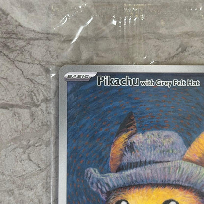 Unopened Gogh Pikachu figure wearing grey felt hat with minor white scratch on lower left side