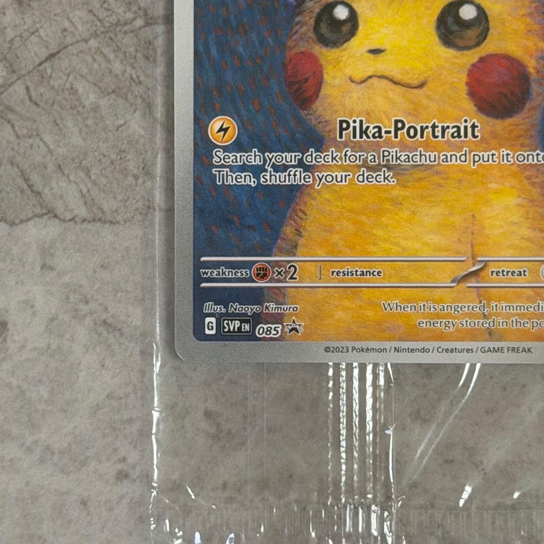 Unopened Gogh Pikachu figure wearing grey felt hat with minor white scratch on lower left side