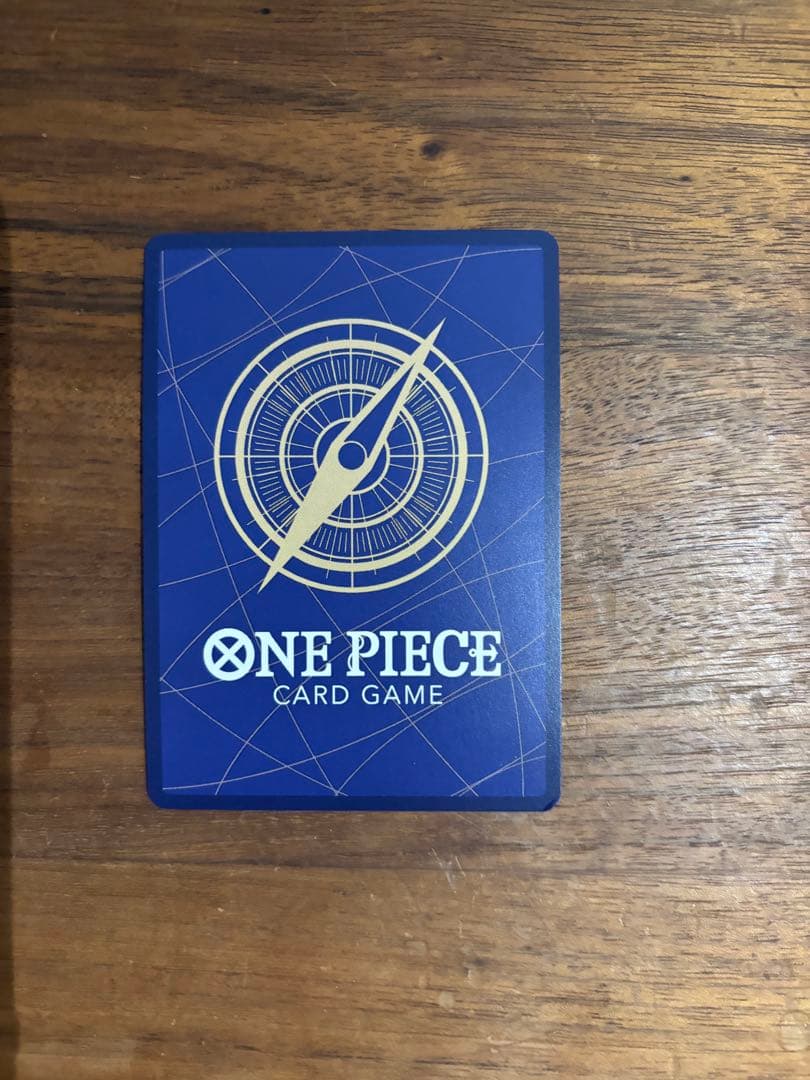 One Piece Portgas D. Ace OP13-119 trading card with slight white specks and fold at lower right edge