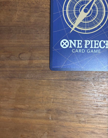 One Piece Portgas D. Ace OP13-119 trading card with slight white specks and fold at lower right edge