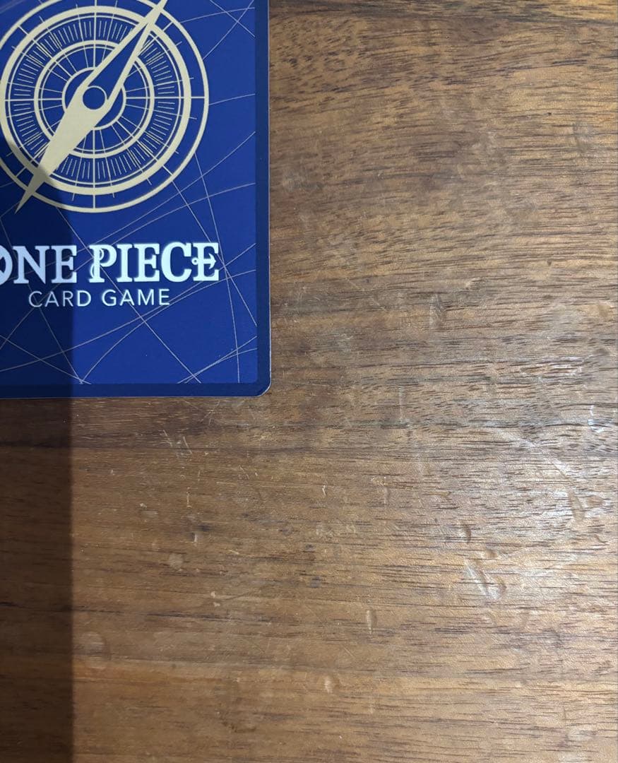 One Piece Portgas D. Ace OP13-119 trading card with slight white specks and fold at lower right edge