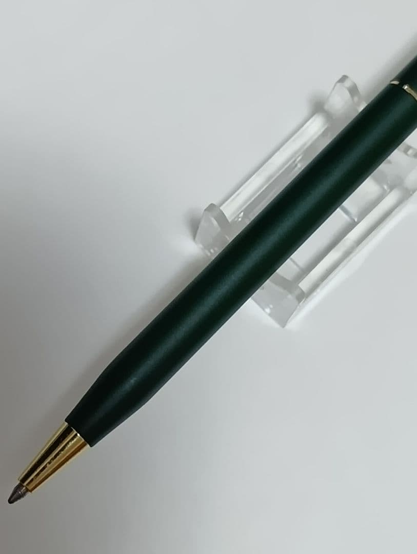 Vintage Cross Classic Century green and gold twist ballpoint pen with minor scratches and gold tarnish