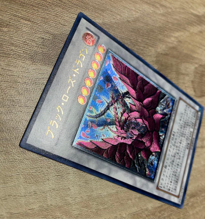 Vintage Yu-Gi-Oh Black Rose Dragon Japanese relief card with visible signs of age and wear
