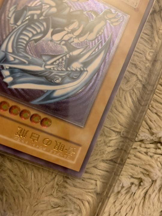Genuine Japanese Yugioh Blue-Eyes White Dragon Leaf SM-51 trading card in good used condition