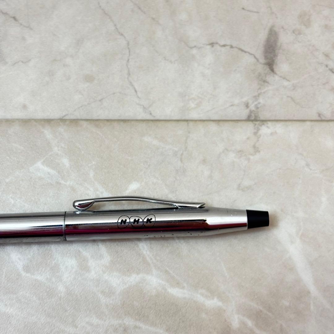 Cross silver ballpoint pen with a slim design displayed next to its matching protective case