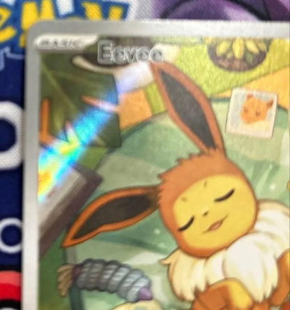Eevee Start Deck 100 Battle Collection 755/742 International Edition collectible card with visible scratch