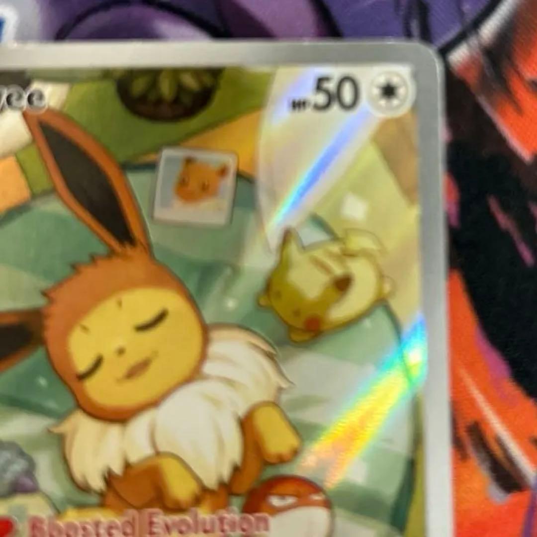 Eevee Start Deck 100 Battle Collection 755/742 International Edition collectible card with visible scratch