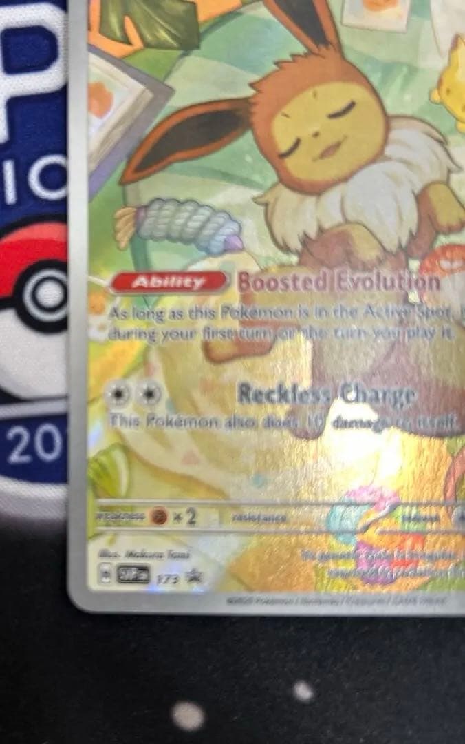 Eevee Start Deck 100 Battle Collection 755/742 International Edition collectible card with visible scratch