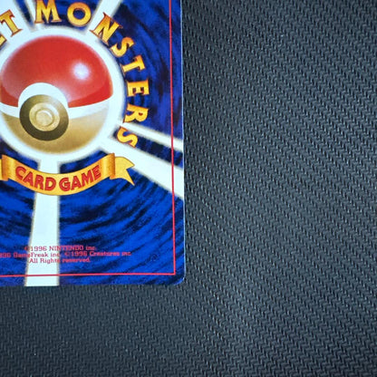 Bandai Pokemon TCG Series 4 Rocket Gang Evil Dragonite trading card pack with visible wear and scratches