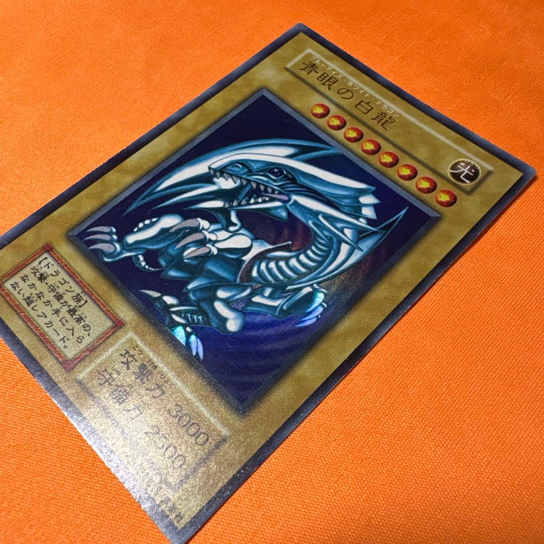 Bandai Blue-Eyes White Dragon Ultra Rare ③ Japanese card with visible scratches and damage