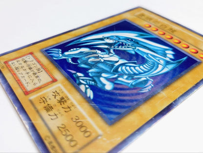 Nintendo Yu-Gi-Oh Blue-Eyes White Dragon starter box edition card with visible signs of use in Japanese