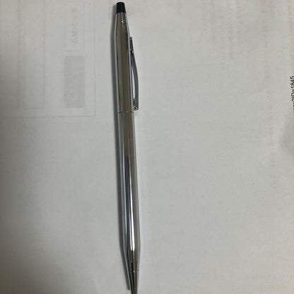 Cross ballpoint pen with black ink and twist-type mechanism on a white background