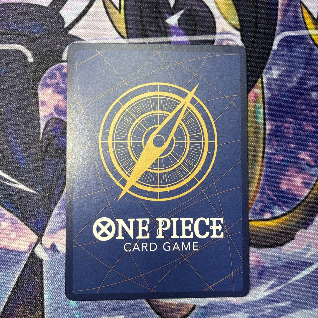 One Piece Monkey D Luffy P-033 collectible card with visible dirt and scratch on white circle area