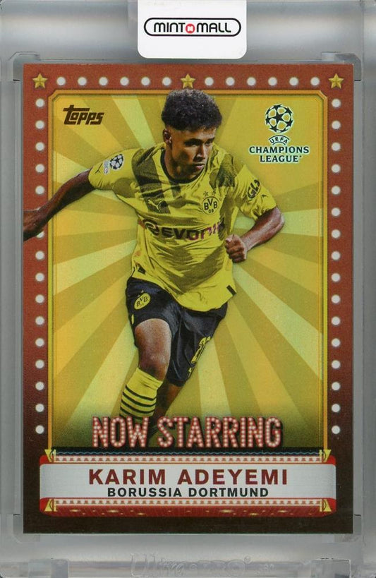 2022-23 Topps UEFA Club Competitions Borussia Dortmund Karim Adeyemi Now Starring Orange #NS-2 parallel card numbered 14 of 25