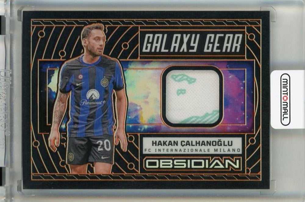 2023-24 Panini Obsidian Hakan Calhanoglu Galaxy Gear Electric Etch Orange trading card serial #1368 of 99