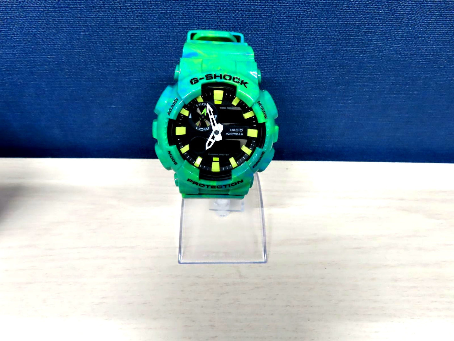 Casio G-Shock GAX-100MB green watch with digital analog display and robust shock resistant design